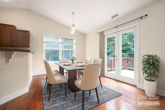29 Honey Hollow Ln, Fairview, NC 28730 - dining room with french doors, hardwood / wood-style floors, lofted ceiling, and healthy amount of natural light