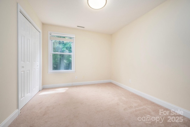 29 Honey Hollow Ln, Fairview, NC 28730 - unfurnished bedroom featuring carpet flooring and a closet