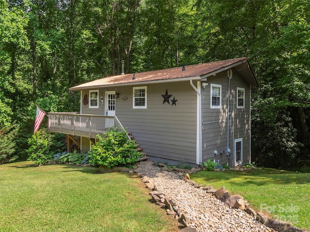 1131 Laurel Branch Rd, Waynesville, NC 28785 - back of property featuring a yard, a wooden deck, stairs, a metal roof, and a forest view