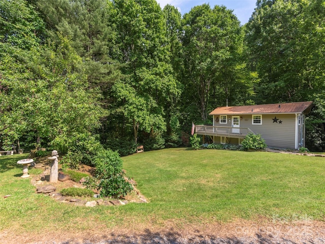 1131 Laurel Branch Rd, Waynesville, NC 28785 - view of grassy yard featuring a wooden deck and a forest view