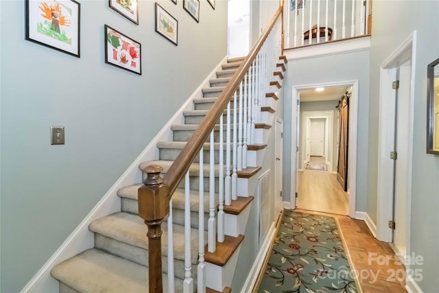 3092 Hitching Post Ln, Rock Hill, SC 29732 - stairway featuring baseboards and a high ceiling