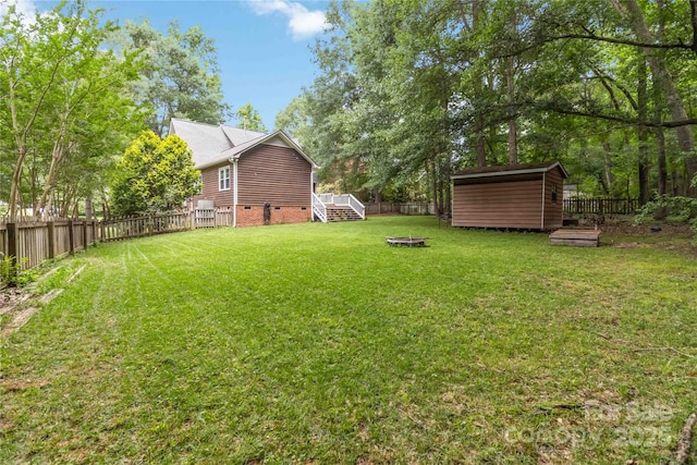 3092 Hitching Post Ln, Rock Hill, SC 29732 - fenced backyard with an outdoor fire pit, a shed, and a wooden deck