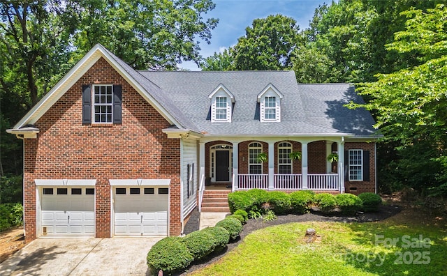 4605 Sarandon Ct, Charlotte, NC 28215 - view of front of home with an attached garage, covered porch, concrete driveway, brick siding, and a shingled roof