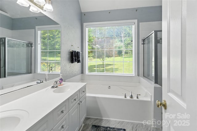 4605 Sarandon Ct, Charlotte, NC 28215 - bathroom featuring double vanity, a bath, and a shower stall