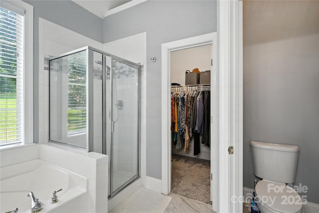 4605 Sarandon Ct, Charlotte, NC 28215 - bathroom with a shower stall, a spacious closet, and a bath