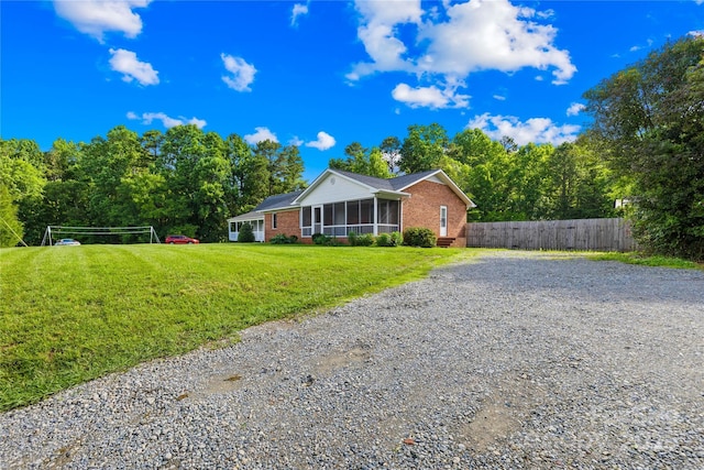 13715 Mayes Rd, Huntersville, NC 28078 - ranch-style house featuring brick siding, gravel driveway, and a sunroom