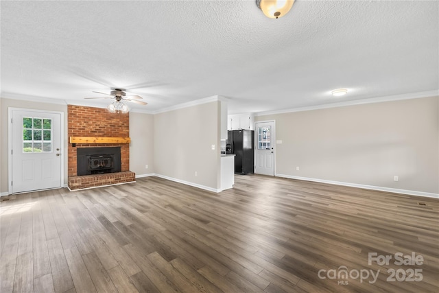 13715 Mayes Rd, Huntersville, NC 28078 - unfurnished living room featuring a textured ceiling, a ceiling fan, crown molding, and dark wood finished floors