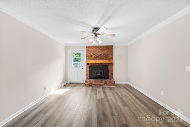 13715 Mayes Rd, Huntersville, NC 28078 - unfurnished living room featuring wood finished floors, a textured ceiling, a ceiling fan, and crown molding