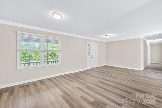 13715 Mayes Rd, Huntersville, NC 28078 - unfurnished room featuring wood finished floors, ornamental molding, and a textured ceiling