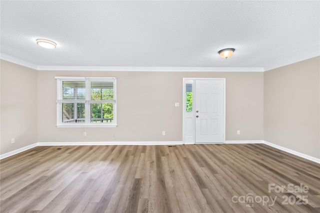 13715 Mayes Rd, Huntersville, NC 28078 - spare room with wood finished floors, crown molding, and a textured ceiling