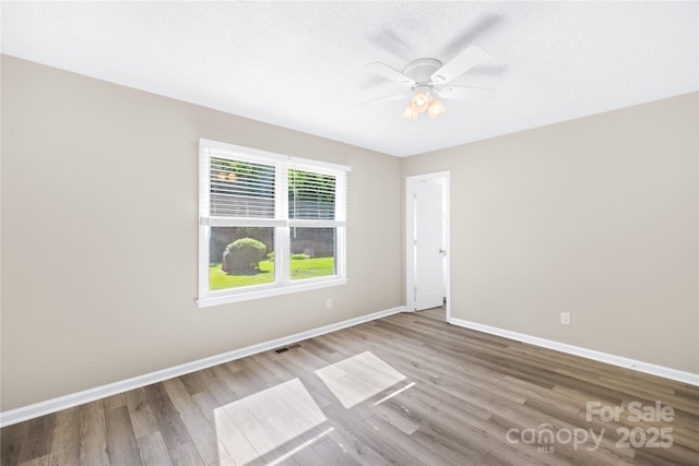 13715 Mayes Rd, Huntersville, NC 28078 - empty room featuring wood finished floors and a ceiling fan