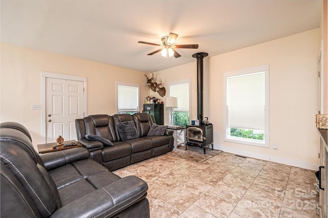 3659 Vashti Rd, Taylorsville, NC 28681 - living room featuring a wood stove and ceiling fan