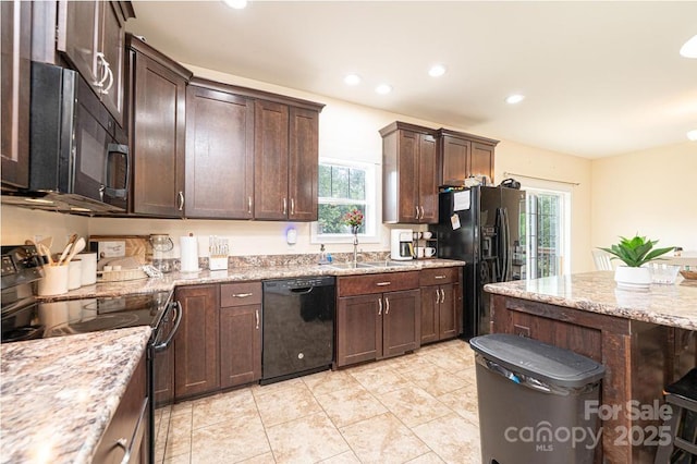 3659 Vashti Rd, Taylorsville, NC 28681 - kitchen featuring black appliances, healthy amount of natural light, dark brown cabinetry, and recessed lighting