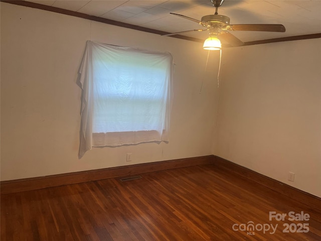 9314 Seymour Ln, Davidson, NC 28036 - empty room with wood finished floors, ceiling fan, and ornamental molding