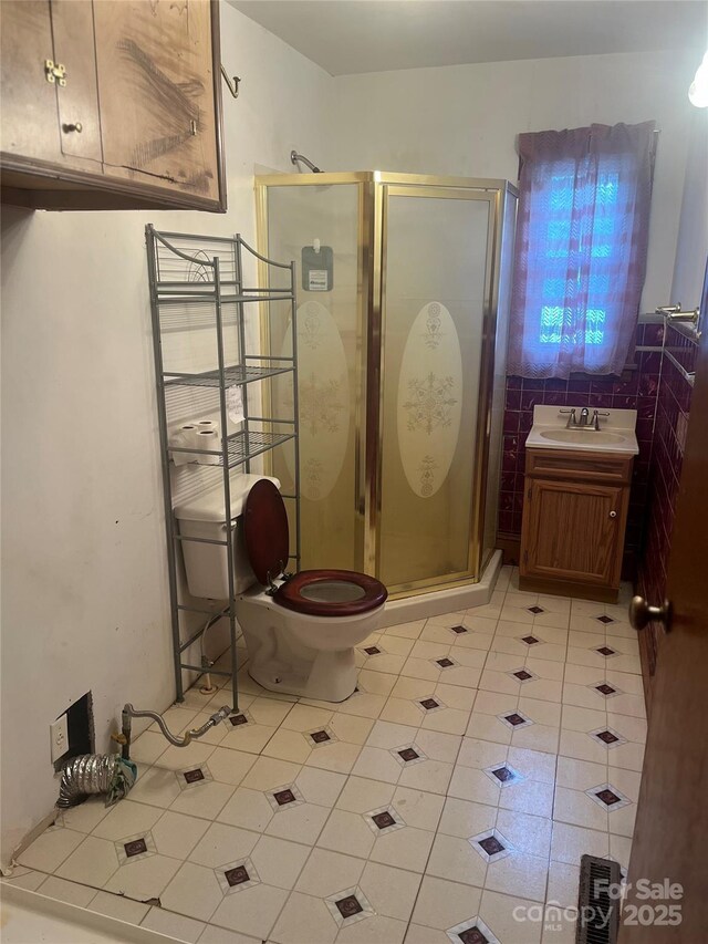 9314 Seymour Ln, Davidson, NC 28036 - bathroom featuring a shower stall, tile patterned flooring, and vanity