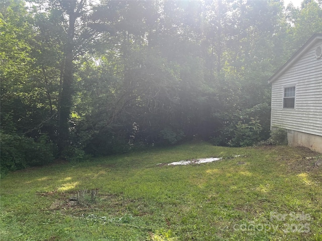 9314 Seymour Ln, Davidson, NC 28036 - view of green lawn featuring a forest view