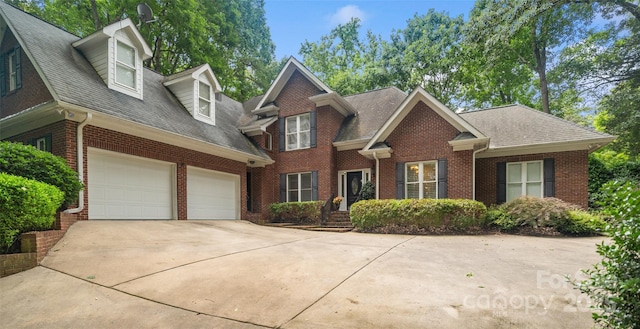 23 Tanglewood Rd, Clover, SC 29710 - view of front of home featuring brick siding, driveway, a shingled roof, and a garage