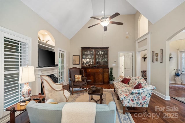 23 Tanglewood Rd, Clover, SC 29710 - living room with arched walkways, high vaulted ceiling, ceiling fan, wood finished floors, and a fireplace