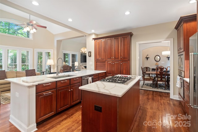 23 Tanglewood Rd, Clover, SC 29710 - kitchen with appliances with stainless steel finishes, a ceiling fan, a center island, open floor plan, and dark wood-style flooring