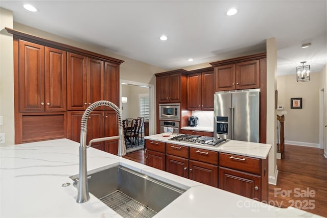 23 Tanglewood Rd, Clover, SC 29710 - kitchen featuring stainless steel appliances, dark wood finished floors, recessed lighting, and light stone counters