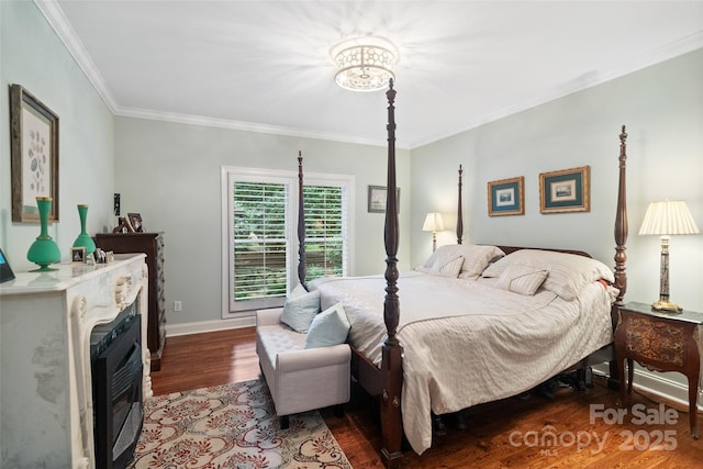 23 Tanglewood Rd, Clover, SC 29710 - bedroom featuring crown molding, wood finished floors, a fireplace, and a chandelier