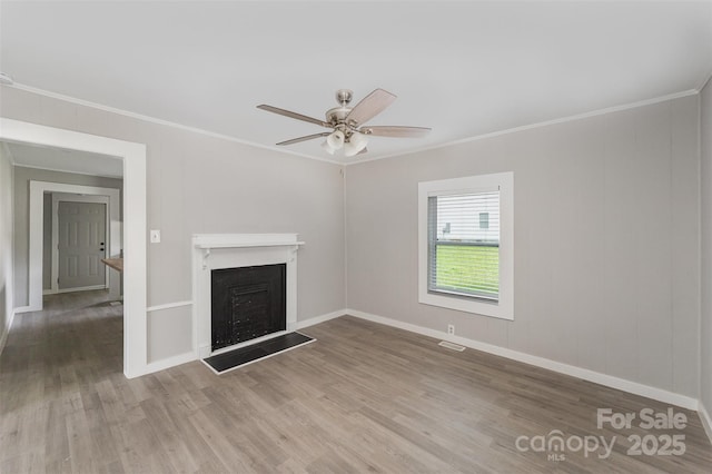 210 Marshall St, Rock Hill, SC 29730 - unfurnished living room featuring crown molding, a fireplace, wood finished floors, and a ceiling fan