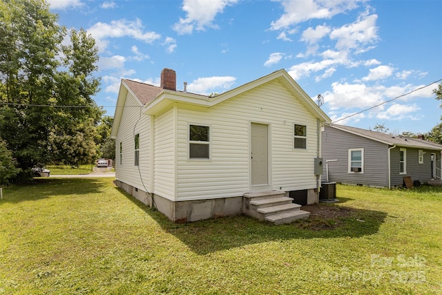 210 Marshall St, Rock Hill, SC 29730 - rear view of property with entry steps, a lawn, and a chimney
