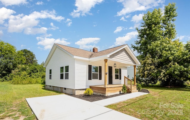 210 Marshall St, Rock Hill, SC 29730 - view of front facade featuring covered porch, a front lawn, a chimney, and crawl space