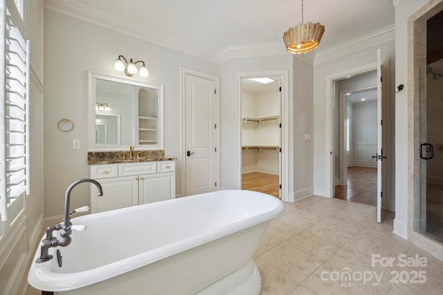 20635 Queensdale Dr, Cornelius, NC 28031 - bathroom with a stall shower, a freestanding bath, crown molding, vanity, and a walk in closet