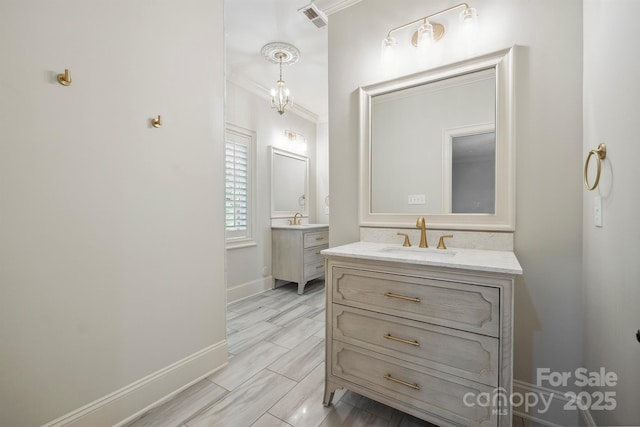 20635 Queensdale Dr, Cornelius, NC 28031 - bathroom with two vanities and ornamental molding
