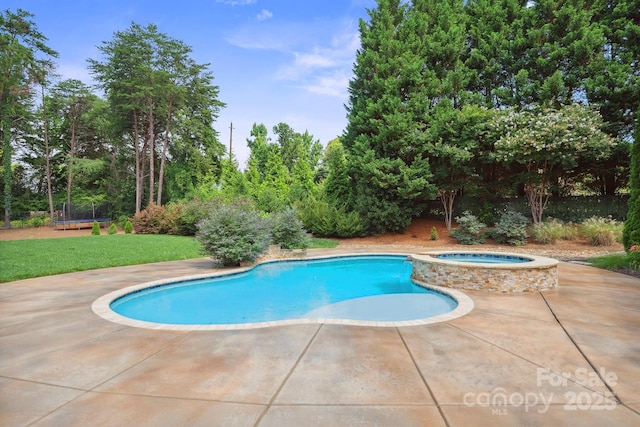 20635 Queensdale Dr, Cornelius, NC 28031 - view of swimming pool with a trampoline, a patio, a yard, and a pool with connected hot tub