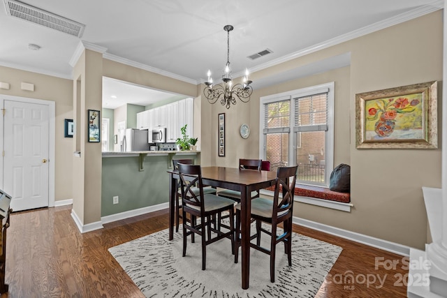 4854 S Hill View Dr, Charlotte, NC 28210 - dining room featuring a chandelier, dark wood-style floors, and ornamental molding