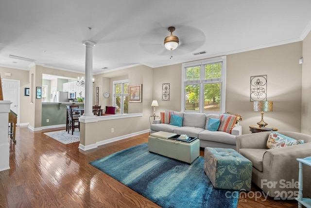 4854 S Hill View Dr, Charlotte, NC 28210 - living room with ornate columns, healthy amount of natural light, a ceiling fan, ornamental molding, and wood finished floors