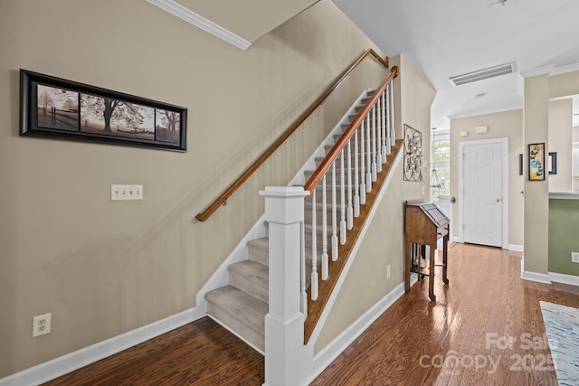 4854 S Hill View Dr, Charlotte, NC 28210 - staircase with crown molding and wood finished floors