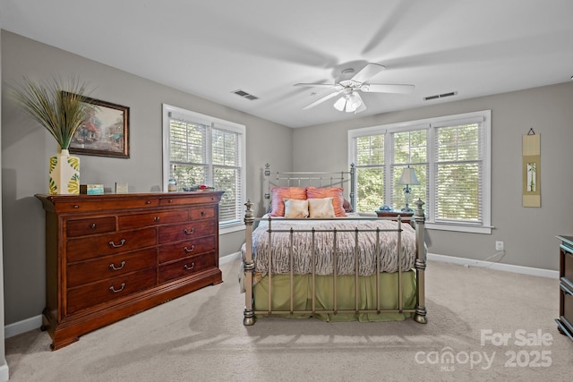 4854 S Hill View Dr, Charlotte, NC 28210 - bedroom with multiple windows, light carpet, and a ceiling fan