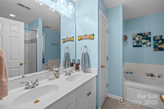 4854 S Hill View Dr, Charlotte, NC 28210 - bathroom with a garden tub, double vanity, tile patterned flooring, and a shower
