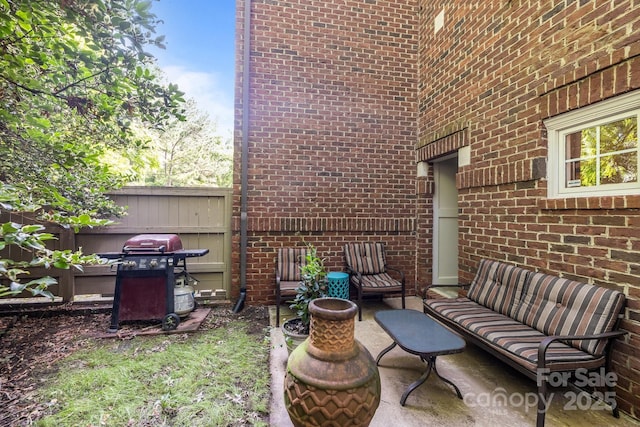4854 S Hill View Dr, Charlotte, NC 28210 - view of patio featuring a grill and an outdoor living space