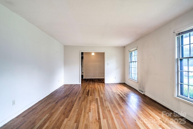 1658 Buckingham Ave, Gastonia, NC 28054 - unfurnished room with plenty of natural light and wood finished floors