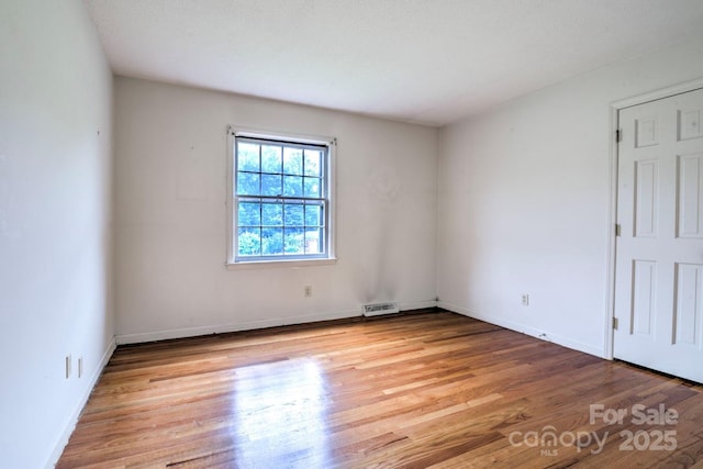 1658 Buckingham Ave, Gastonia, NC 28054 - unfurnished room with wood finished floors and baseboards