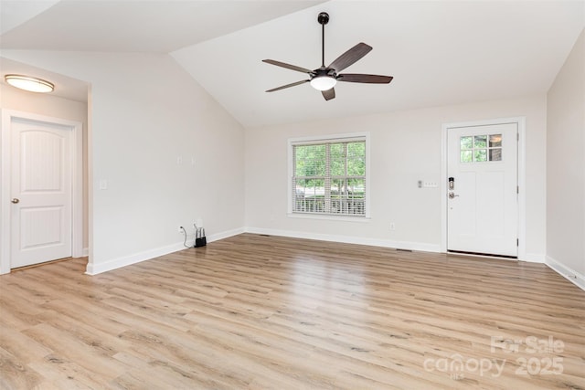 43 Paddington Dr SW, Concord, NC 28025 - unfurnished living room with lofted ceiling, a ceiling fan, and light wood finished floors