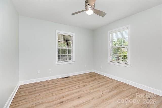 43 Paddington Dr SW, Concord, NC 28025 - empty room with wood finished floors and ceiling fan