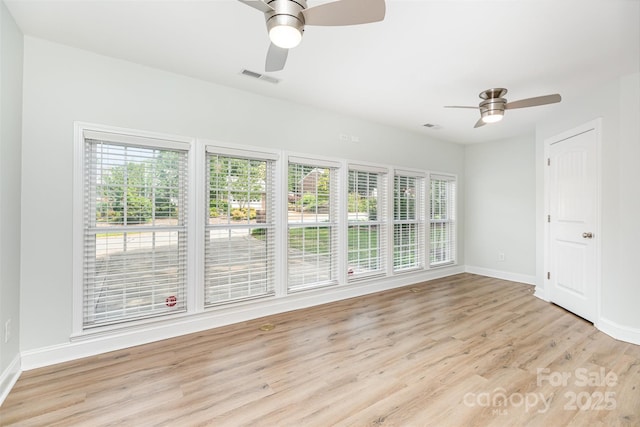 43 Paddington Dr SW, Concord, NC 28025 - spare room with ceiling fan, healthy amount of natural light, and light wood-type flooring
