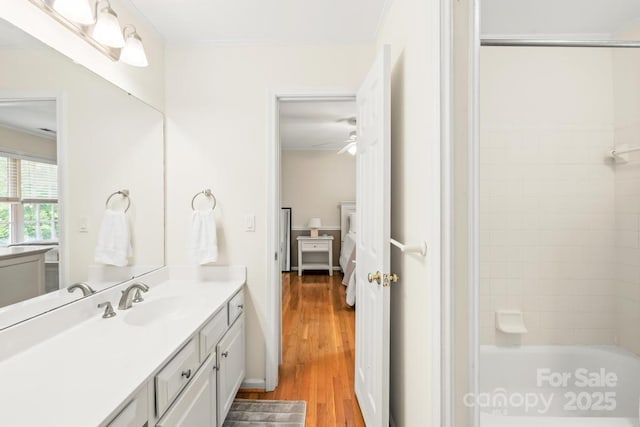9514 Hayenridge Ct, Huntersville, NC 28078 - ensuite bathroom featuring vanity, wood finished floors,  shower combination, ceiling fan, and crown molding