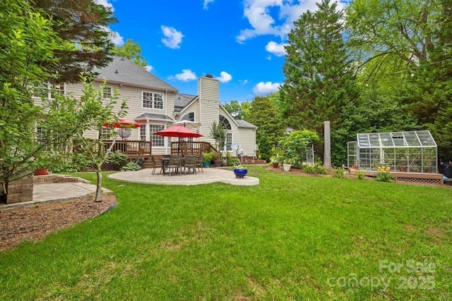9514 Hayenridge Ct, Huntersville, NC 28078 - view of grassy yard featuring an exterior structure, a patio, a wooden deck, and an outdoor structure