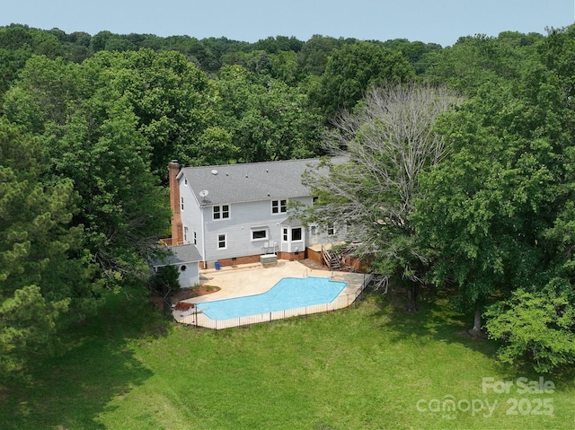 5632 Zion Church Rd, Concord, NC 28025 - back of property featuring a wooded view, a chimney, a yard, and a deck