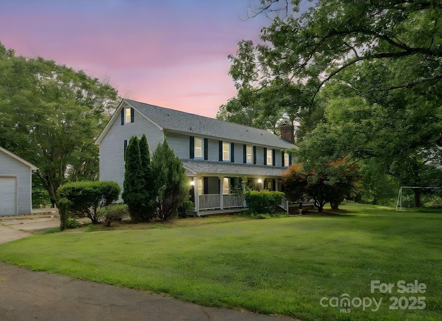 5632 Zion Church Rd, Concord, NC 28025 - colonial-style house with a chimney, a porch, a yard, and an outdoor structure