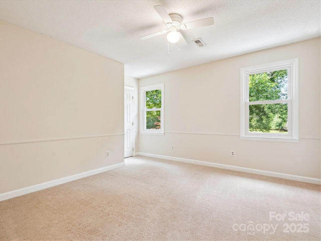 5632 Zion Church Rd, Concord, NC 28025 - empty room featuring light carpet, a ceiling fan, and a textured ceiling