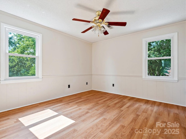 5632 Zion Church Rd, Concord, NC 28025 - spare room featuring plenty of natural light, light wood-style floors, ceiling fan, and crown molding