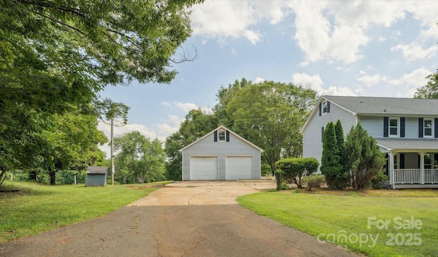5632 Zion Church Rd, Concord, NC 28025 - view of property exterior with an outdoor structure, a garage, and a lawn