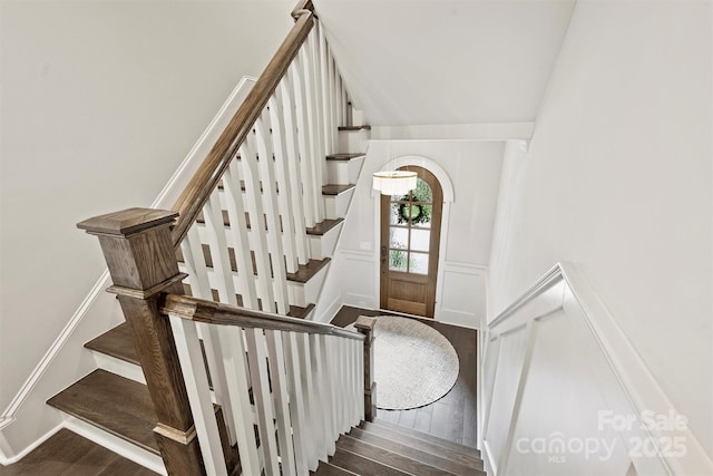 622 Mattie Rose Ln, Charlotte, NC 28204 - staircase with wood finished floors, wainscoting, and a decorative wall